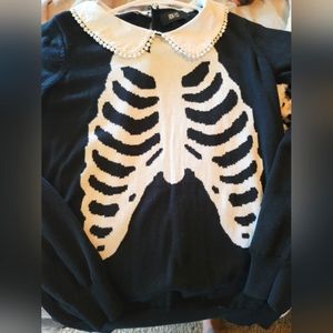 Iron Fist ribcage sweater from Hot Topic in size Large